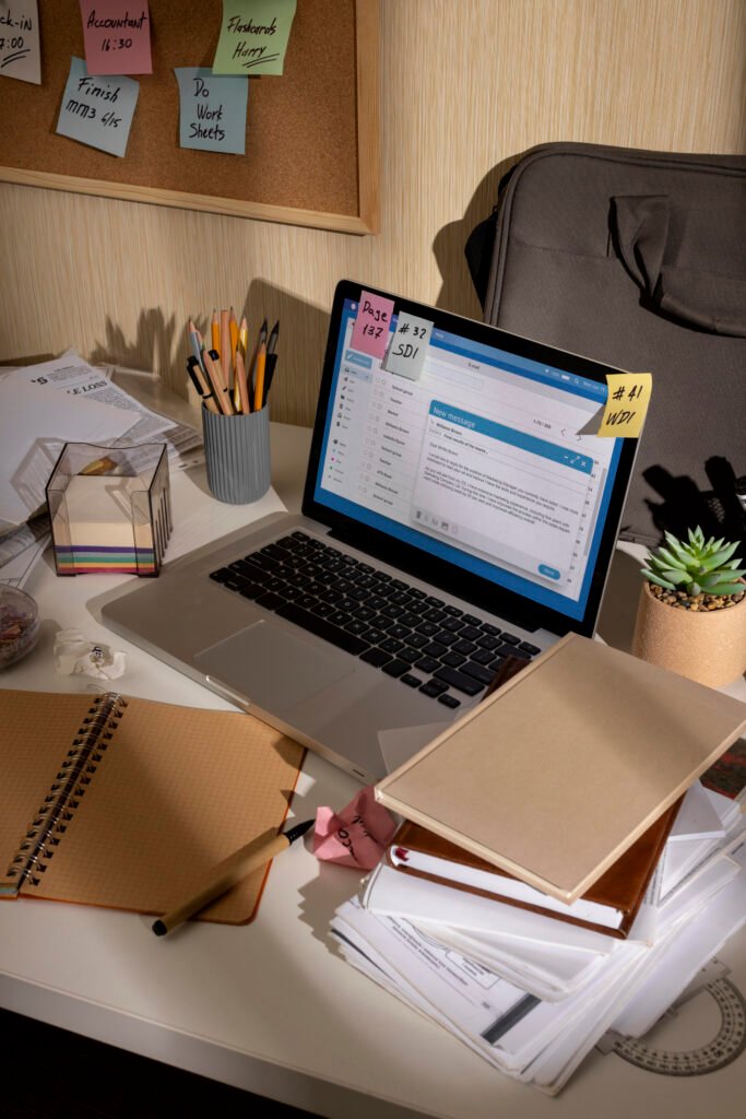 view messy office workspace with laptop device
